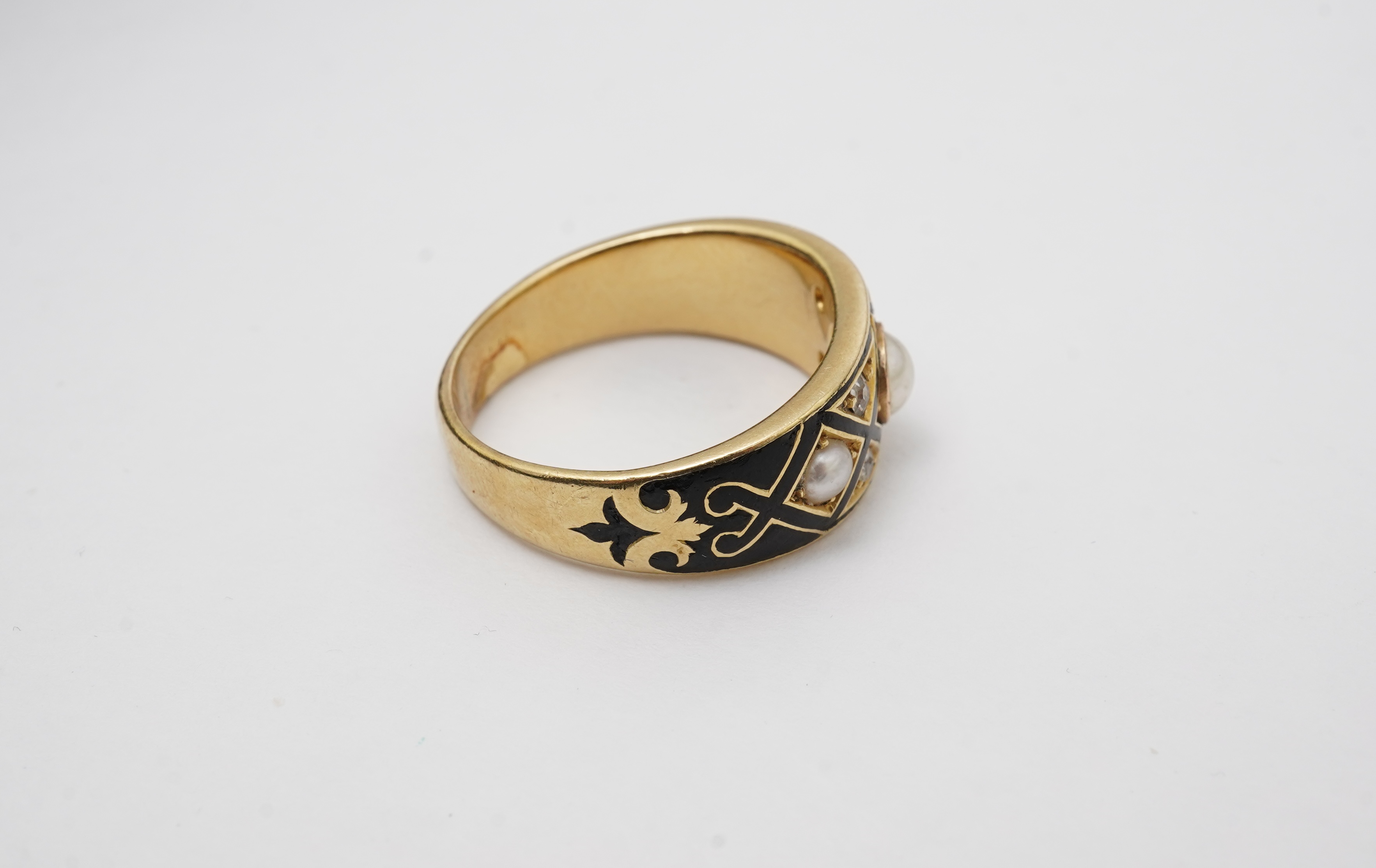 A Victorian pearl, enamel and diamond mourning ring, late 19th century